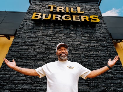 Bun B In Front Of His Shop Called Trill Burgers