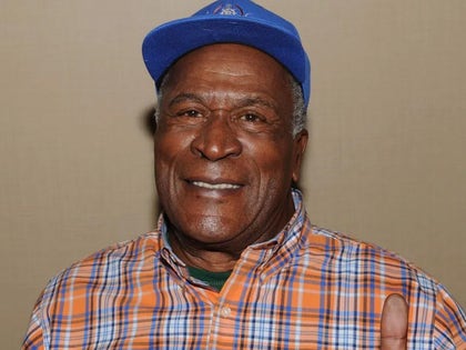 John Amos Smiling With A Blue Hat On