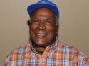 John Amos Smiling With A Blue Hat On