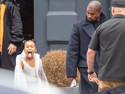 1010 North West pokes her tongue out to photographers in North London back