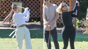 Kim & Khloe Kardashian Go Swinging on a Golf Course