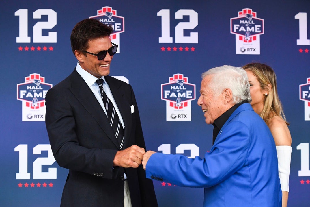 Tom Brady fist bumps New England Patriots CEO Robert Kraft