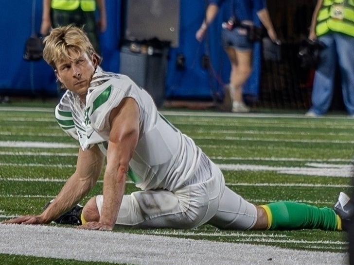 Glen Powell Dress In A Football Uniform