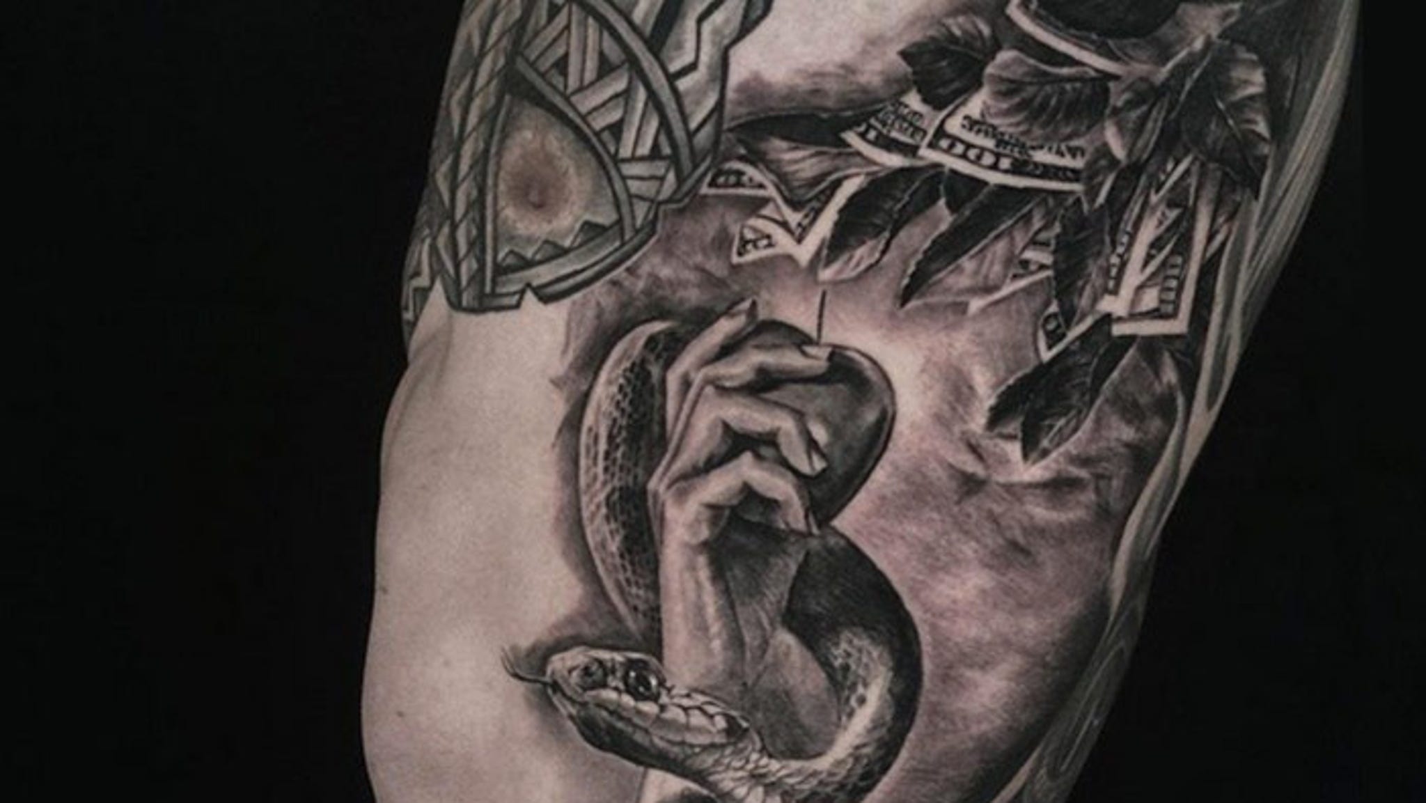 Colin Kaepernick's New Tattoo -- Money Is the Root Of All Evil.