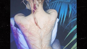 Grimes Reveals Massive Back Tattoo of 'Beautiful Alien Scars'