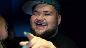 Ken Flores dies article primary image. Ken Flores smiling and pointing in a black hat, black t-shirt, and bracelet. January 29, 2025.