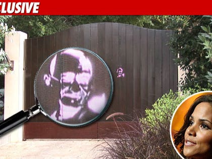 0723_halley_berry_magnifying_glass