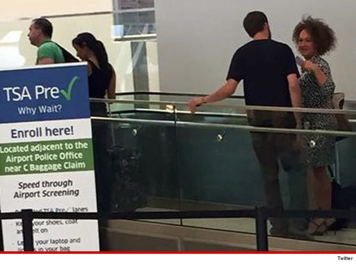 Rachel Dolezal -- Just Blending In PHOTO :: 0615-rachel-dolezal-leaving-airport-twitter-4