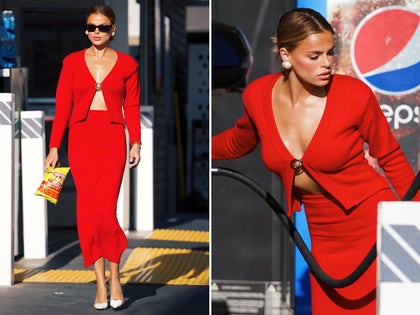 Brooks Nader Pumping Gas With A Low-Cut Red Top And Matching Skirt