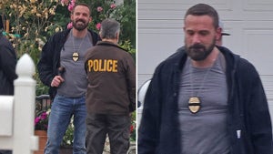 Ben Affleck On Set In a Tee Shirt With A Police Badge Necklace