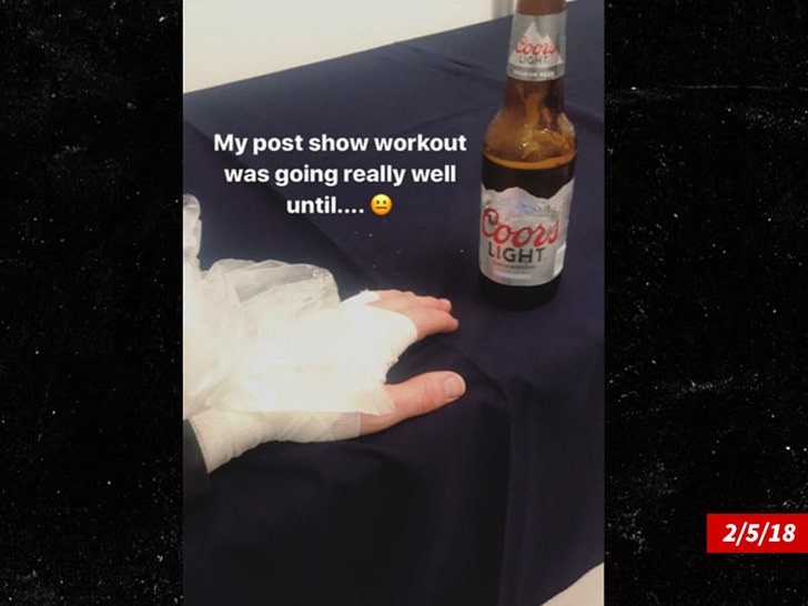 0517-nick jonas hand injury 2018