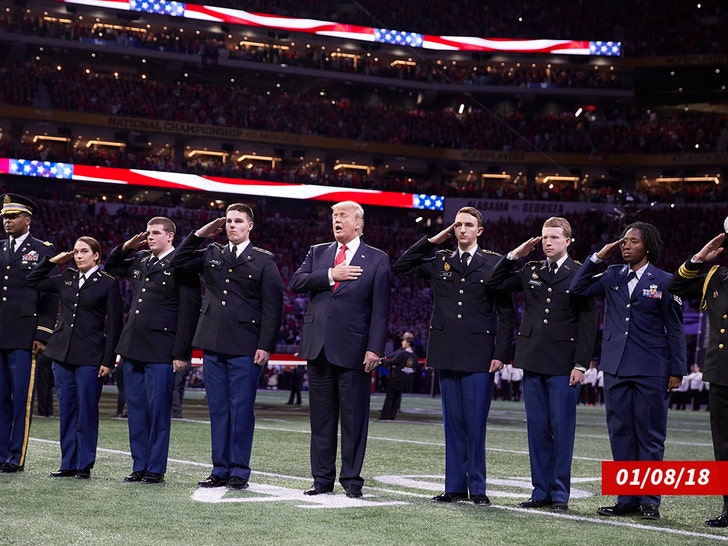 Donald Trump and First Lady Melania Trump stand during the national anthem prior to the NCAA college football playoff championship game getty 2