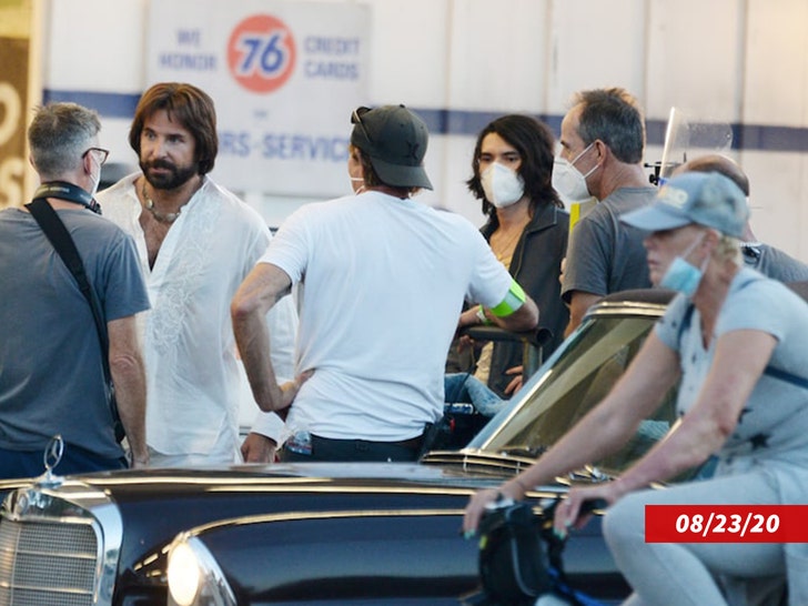 Bradley Cooper Steps Through Smoke While Filming A Commercial For