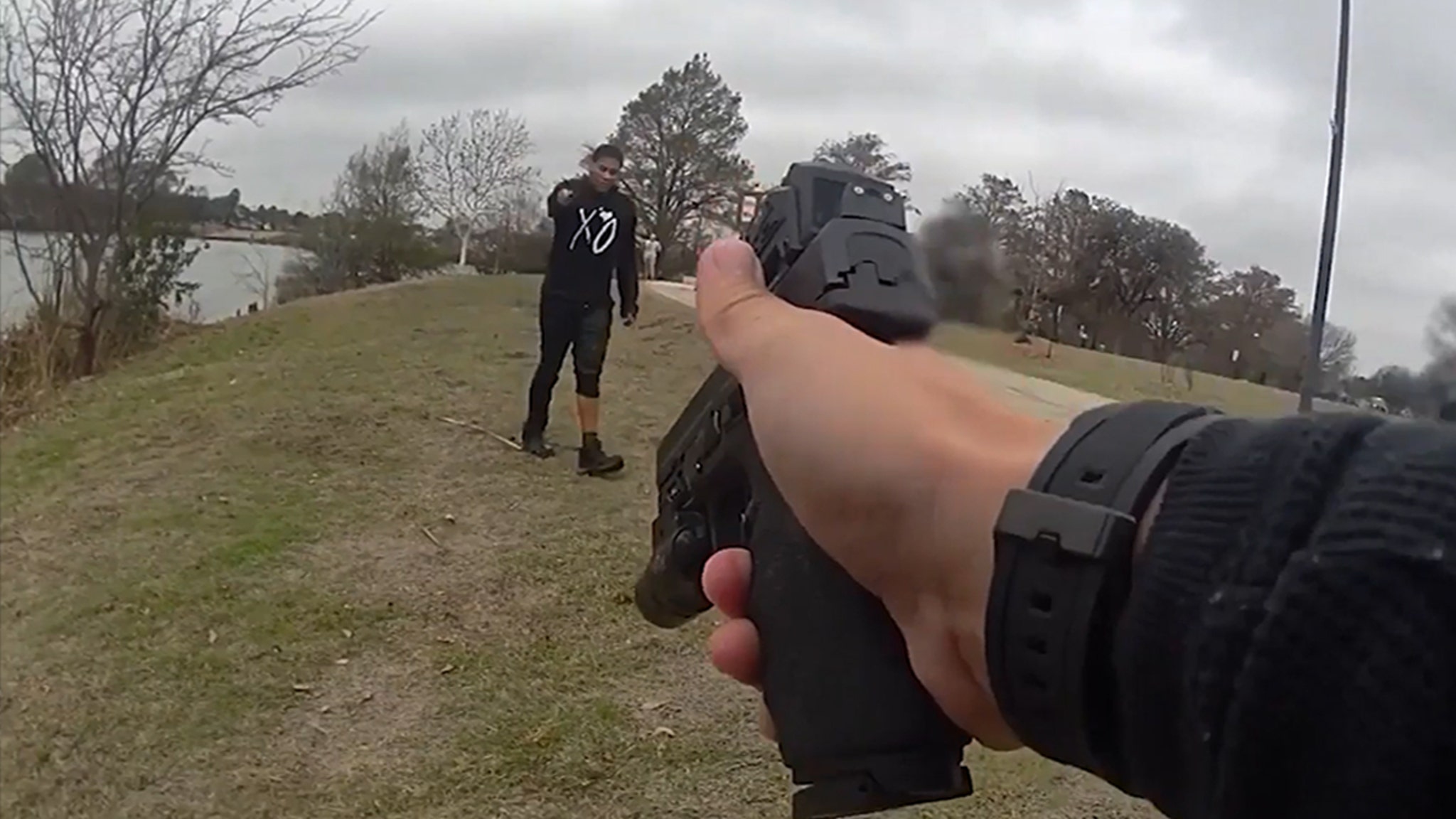 Police Officer Begs Man to Put Down Knife After He Climbs Out of Car in Lake, on Video