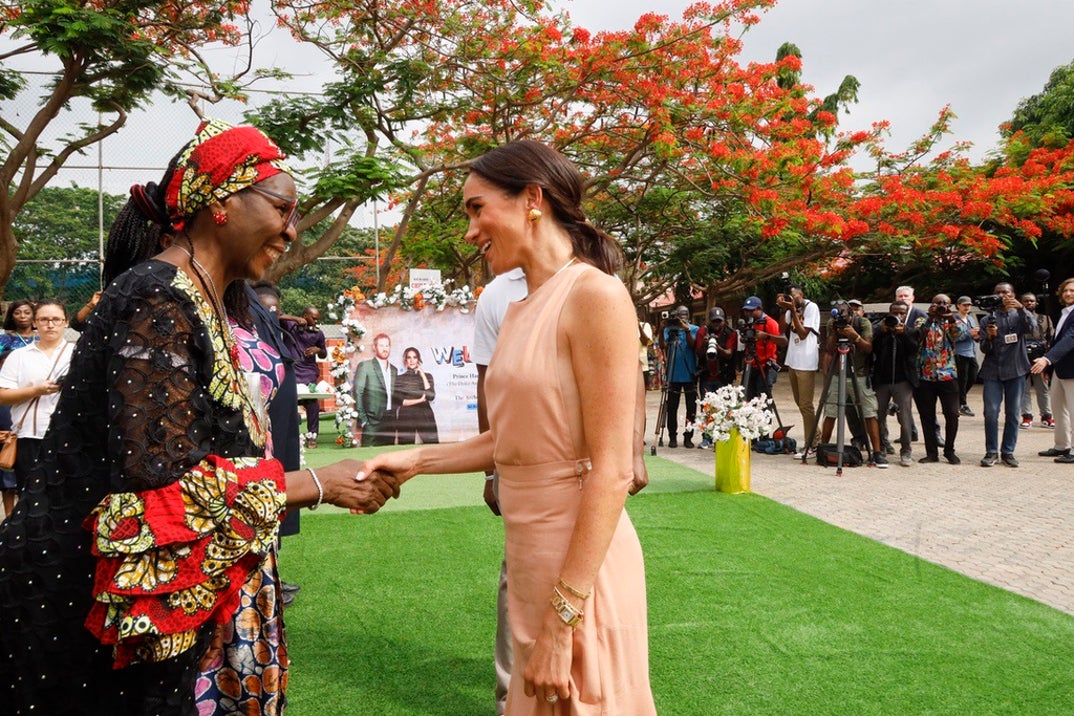 meghan markle red dress nigeria Meghan Markle Calls Nigeria 'My Country' in Candid Chat