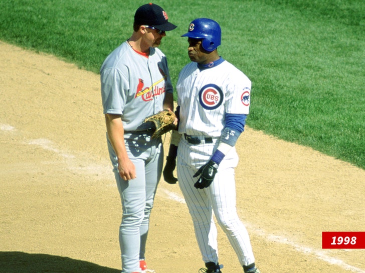 Mark McGwire #25 of the St. Louis Cardinals talks with Sammy Sosa
