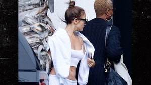 Newly single Jennifer Lopez flashes her abs