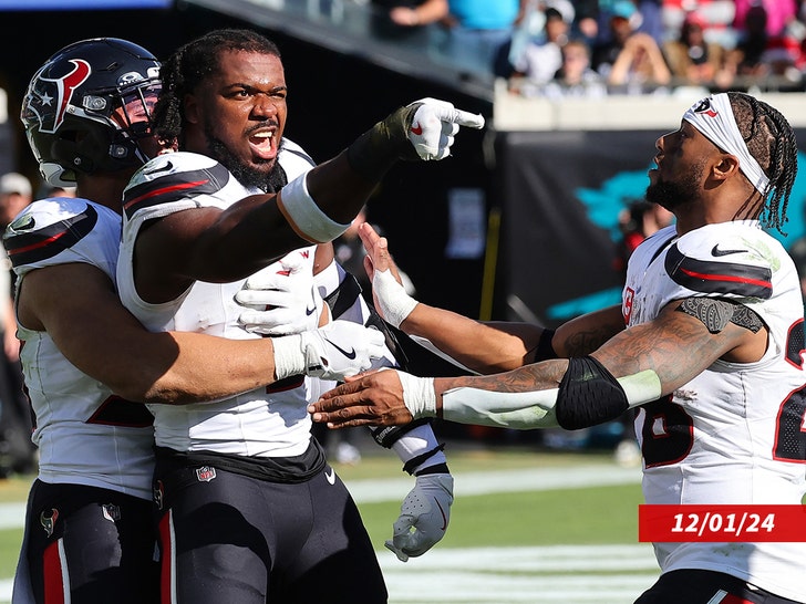 Azeez Al-Shaair #0 of the Houston Texans points to the Jacksonville Jaguars bench after a fight and being ejected during the second quarter of a game at EverBank Stadium on December 01, 2024