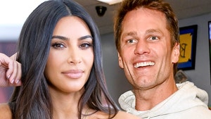 Kim Kardashian and Tom Brady Have Flirty Fun During Bidding War Over Expensive Art