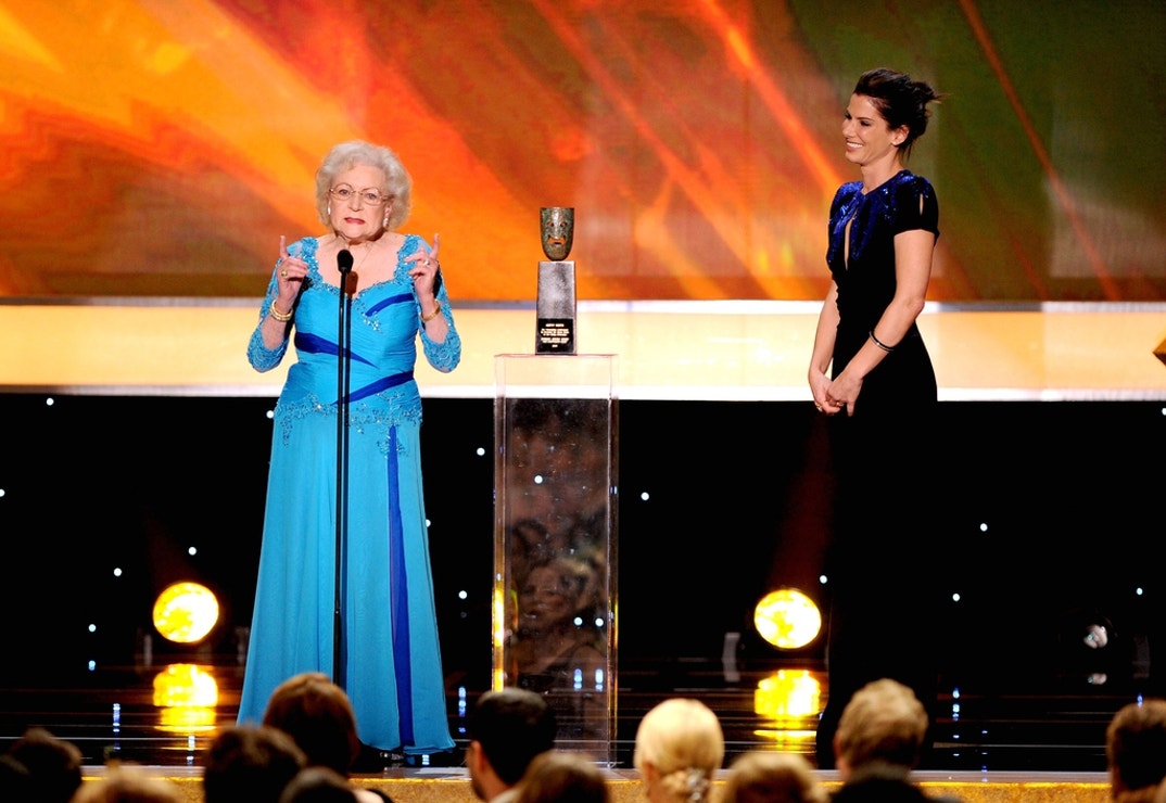 Actress Sandra Bullock (R) presents actress Betty White the Life Achievement Award onstage at the 16th Annual Screen Actors Guild Awards