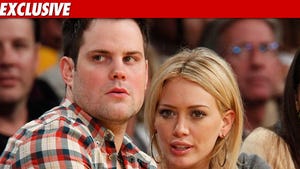 1001_mike_comrie_hilary_duff_EX_getty