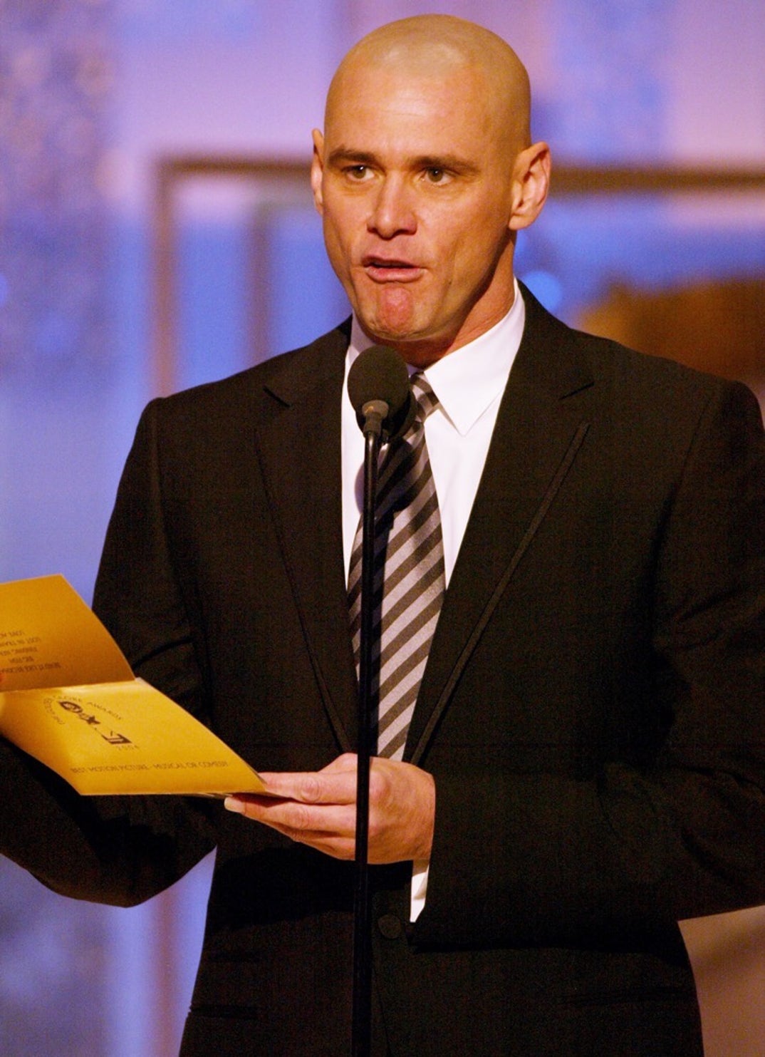 2004 -- Jim Carrey takes the stage in a striped tie to announce the award for The Best Musical or Comedy.