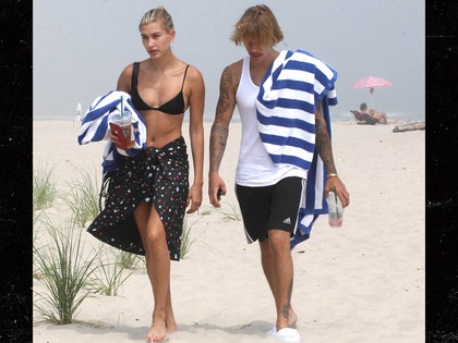 0704-Hailey-Baldwin-Stops-for-Some-Iced-Drink-Before-Heading-to-the-Beach-With-Justin-Bieber-beach-tower-beach