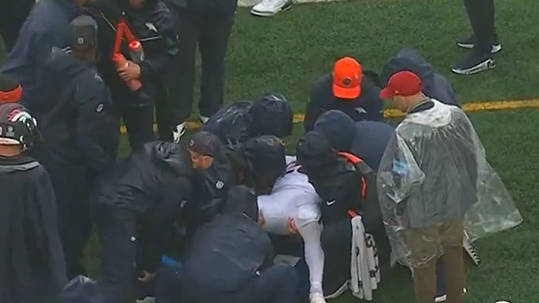 Tyler Badie of the Denver Broncos collapses on the sideline during the Jets game