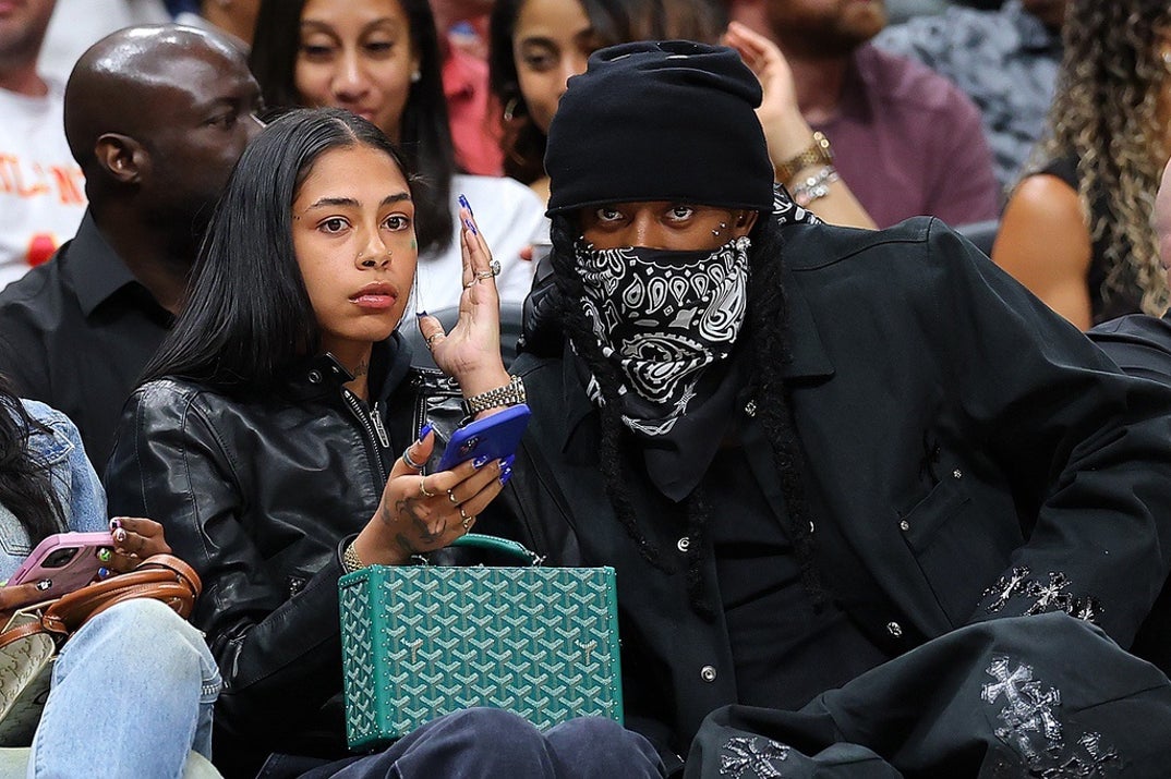 Playboi Carti keeps a low profile while hanging courtside at the Hawks vs. Trail Blazers game at State Farm Arena on April 01, 2025 in Atlanta