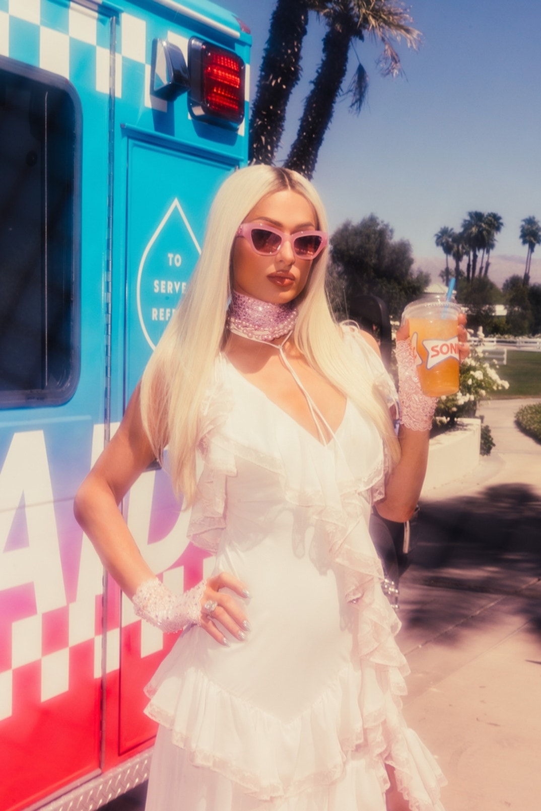 Paris Hilton sips a Sonic Refresher at her Parívie party in Palm Desert.