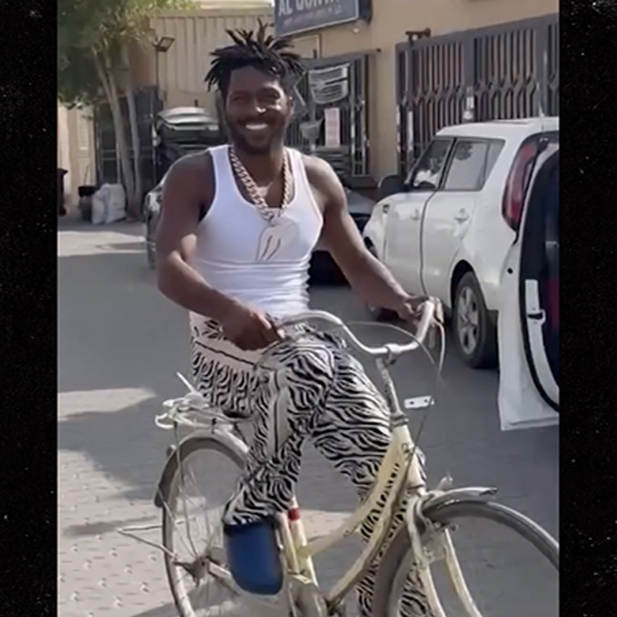 Antonio Brown All Smiles On Bike Ride Despite Arrest Warrant