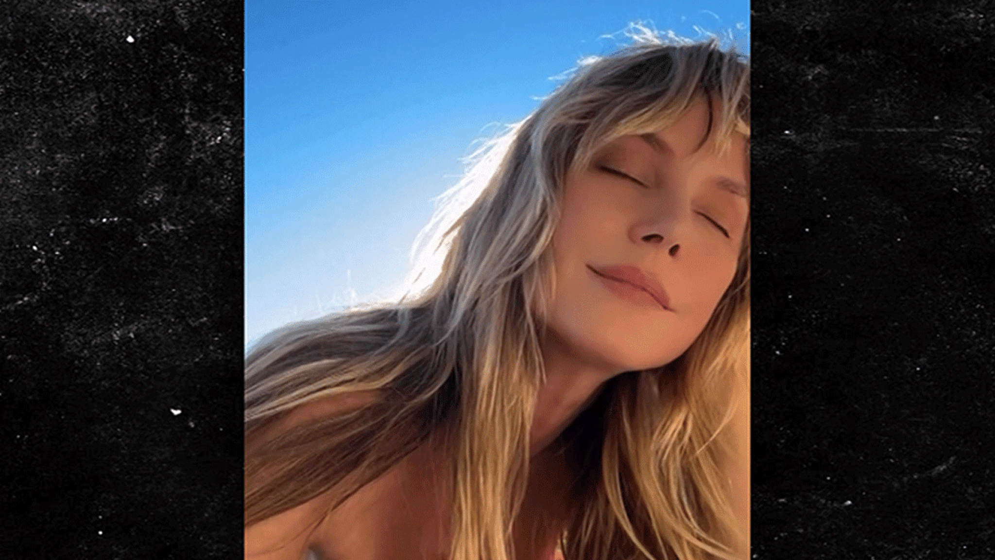 Heidi Klum bruint topless, op video