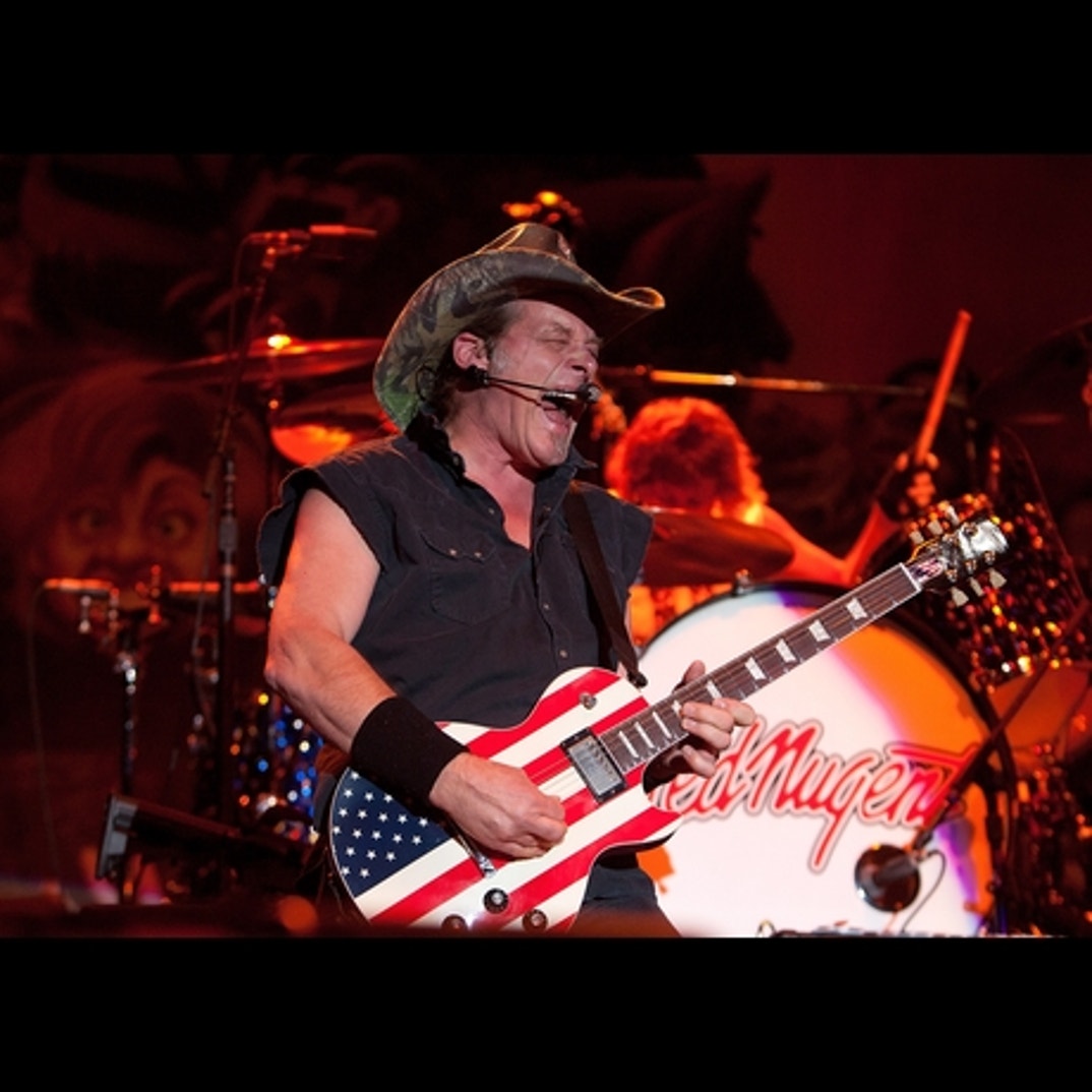 Ted Nugent rocks on his patriotic guitar!
