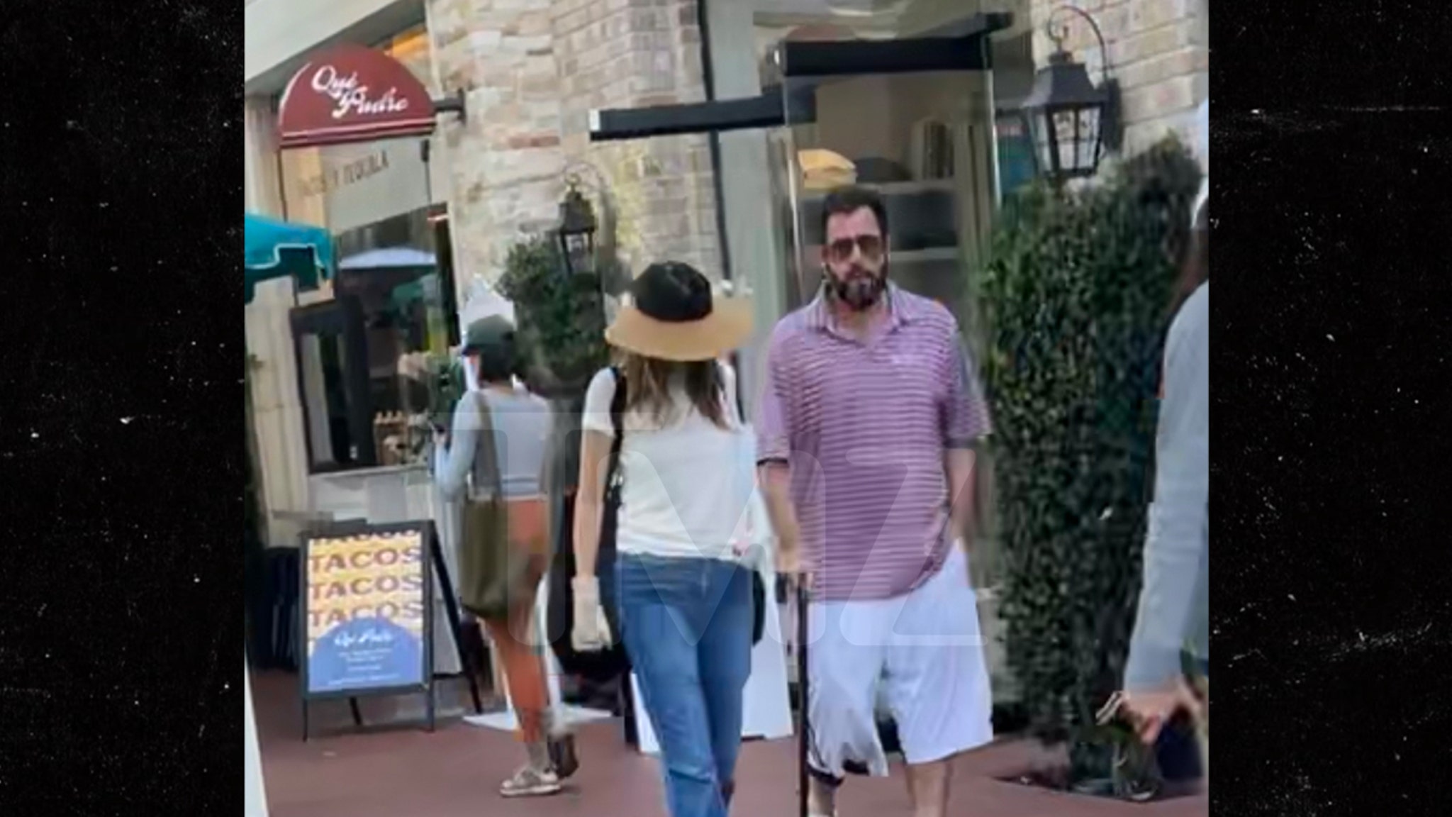 Adam Sandler uses the cane while recovering from hip surgery