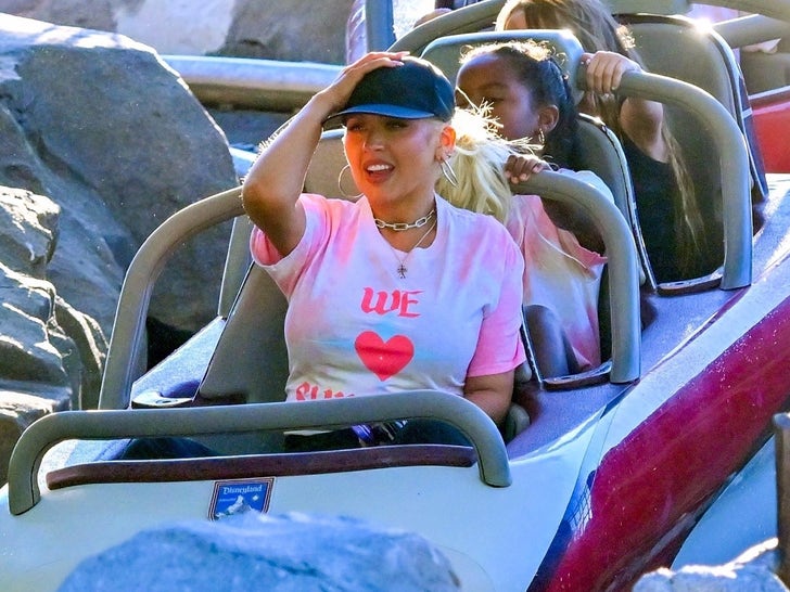 0817-Christina-Aguilera-Disneyland-Scooter-Rides-photos-primary-4