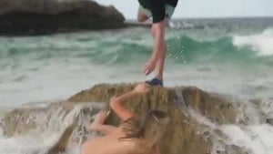 Kate Upton Swept Off Her Feet During Topless SI Swimsuit Shoot