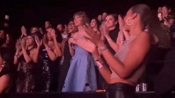 101223_taylor_swift_movie_standing_ovation_kal