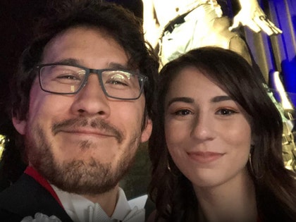 Markiplier and his wife Amy Nelson are seen posing for a selfie.