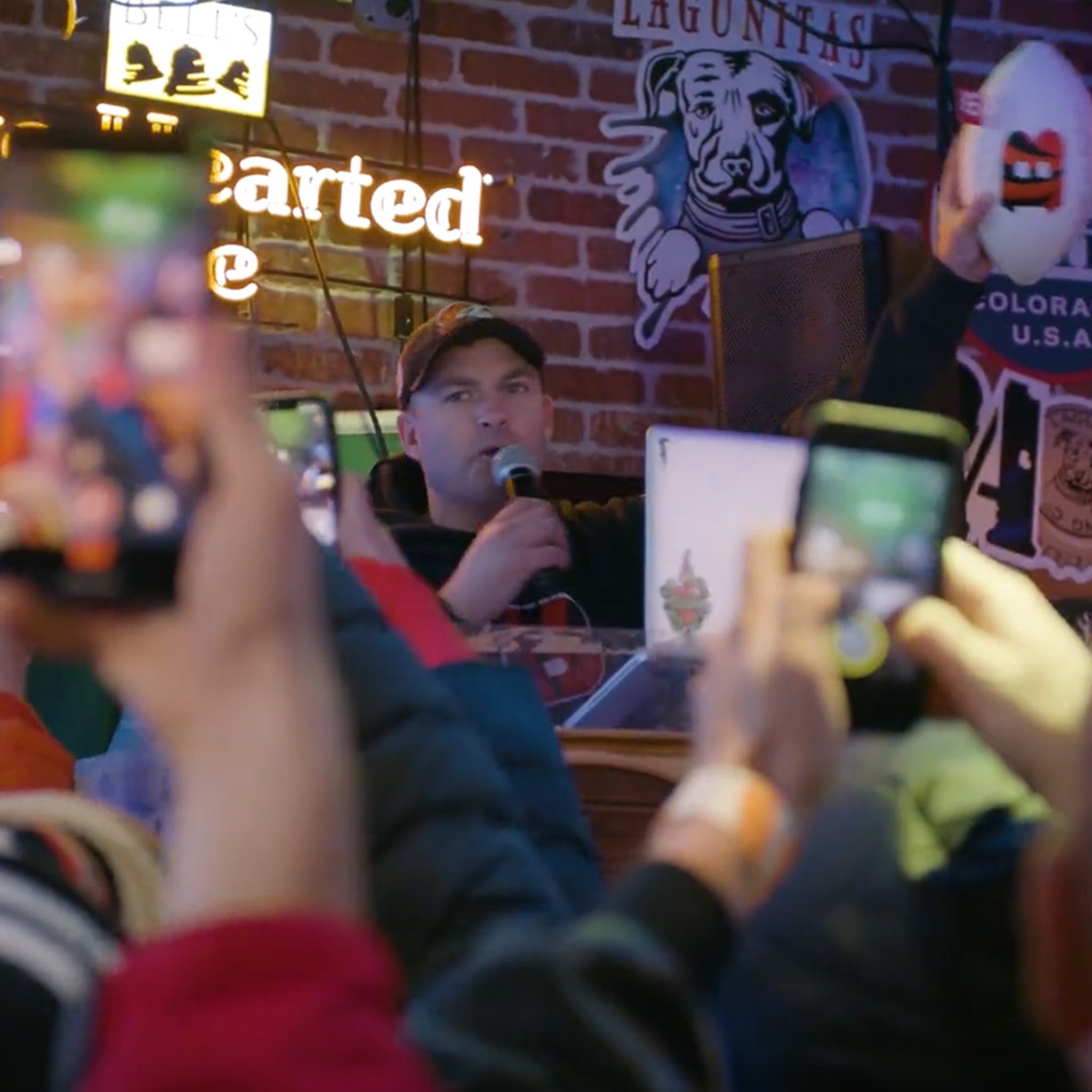 Bengals head coach presents game ball to local bars