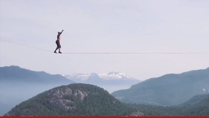 Life On The Line -- Man Walks Between Peaks  On A Rope!!! (VIDEO)