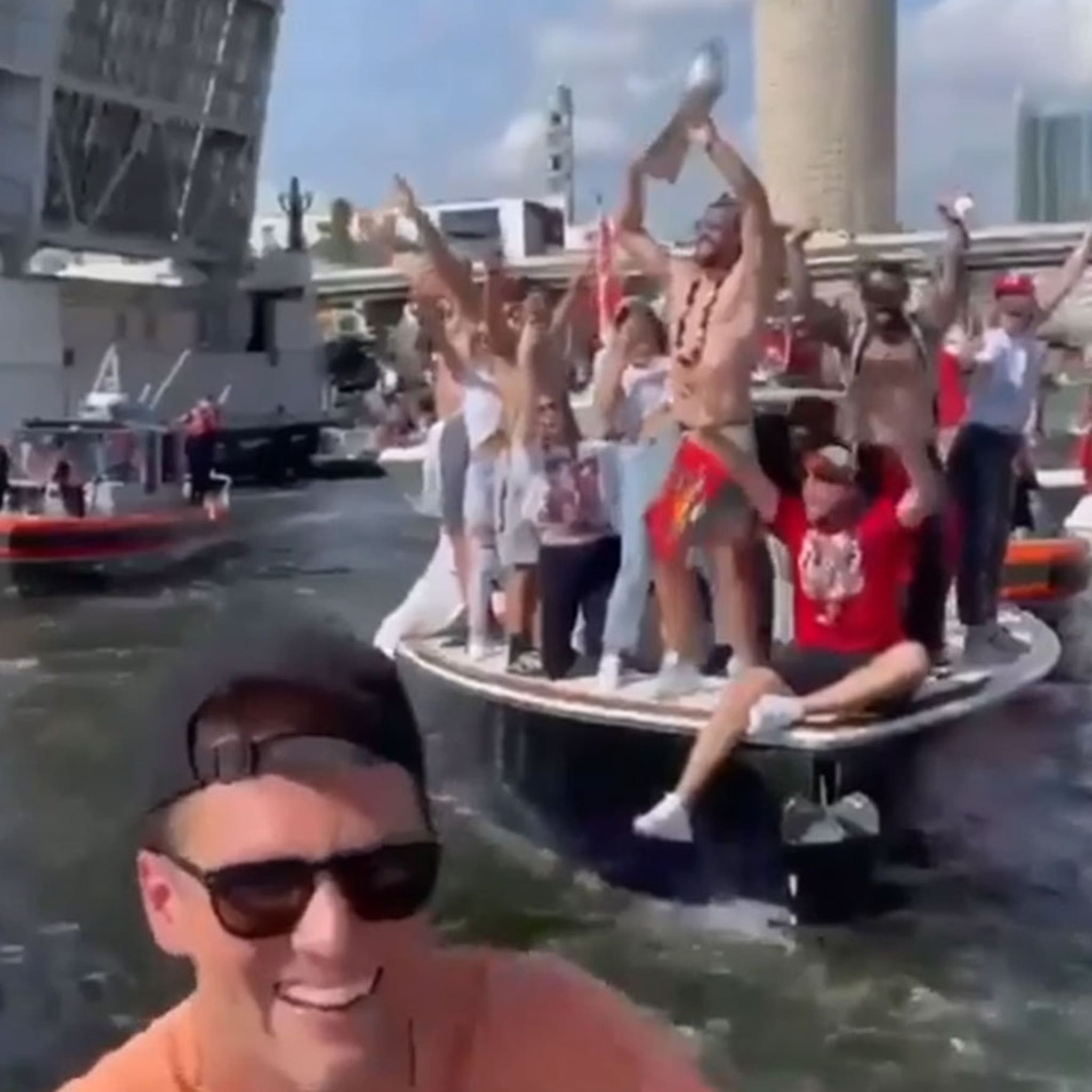 Watch Tom Brady toss Lombardi Trophy from one boat to another