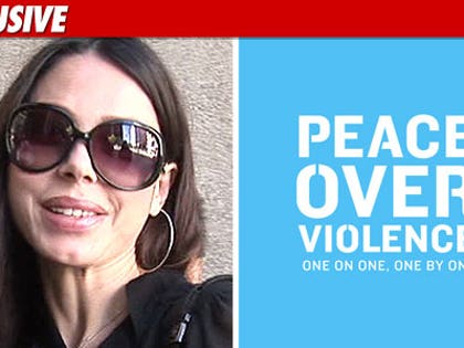 1115_oksana_peace_over_violence_EX_tmz