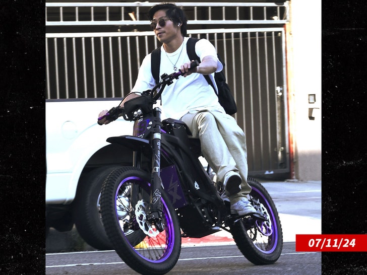 Pax Jolie-Pitt enjoys a ride on his electric bike