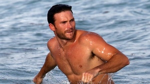 Scott Eastwood Takes a Dip, Chats Up Hot Chick at the Beach