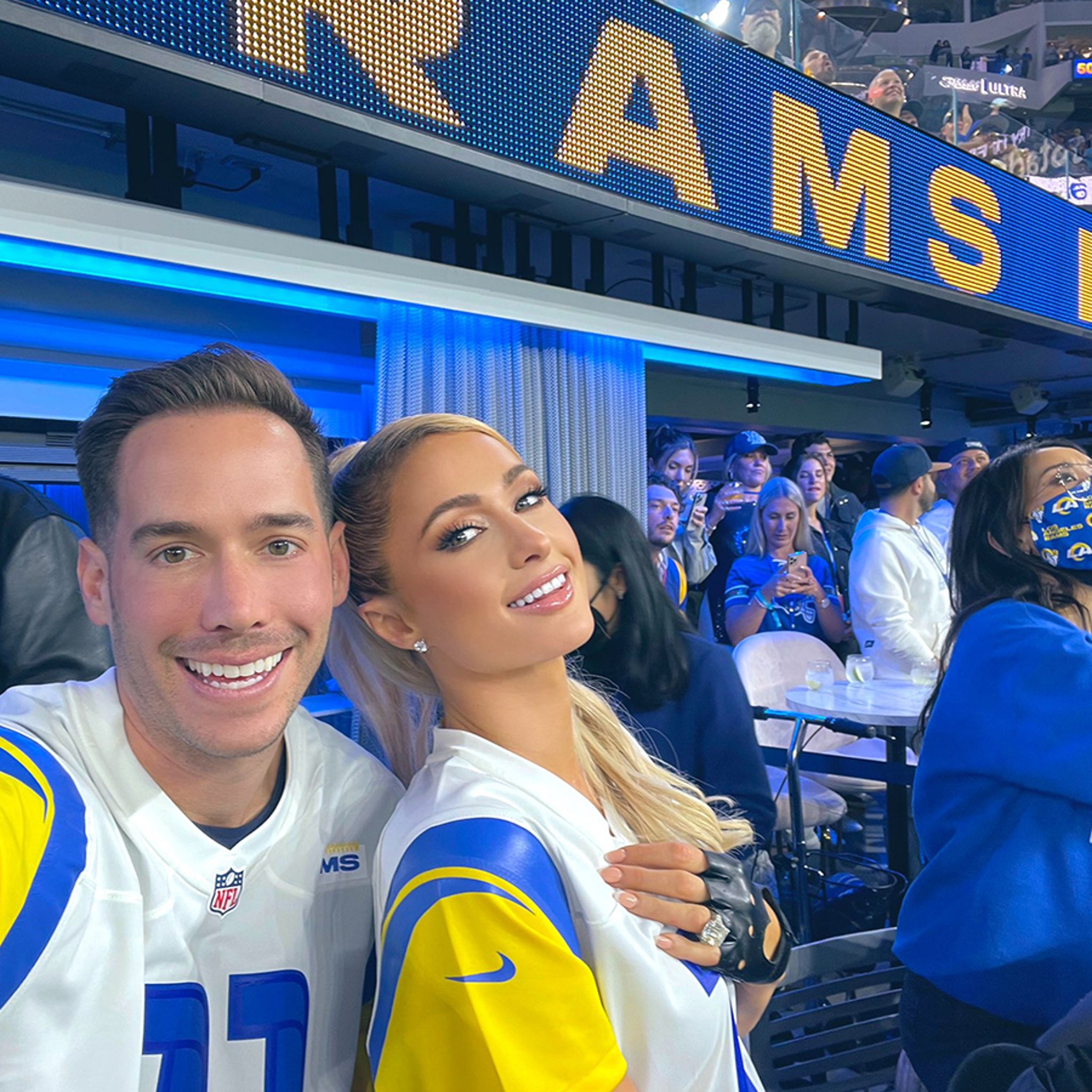 Shutterstock Now - Too cute! Paris Hilton and fiance Carter Reum sport  matching Los Angeles Rams jerseys with the number 11 on it during LA's game  against the Tennessee Titans at SoFi