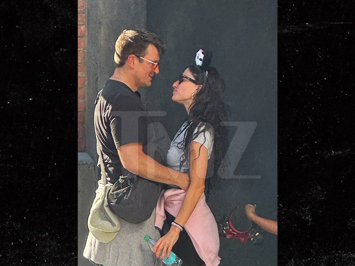 Nathan Fillion and Tania Raymonde at Disneyland tmz 2