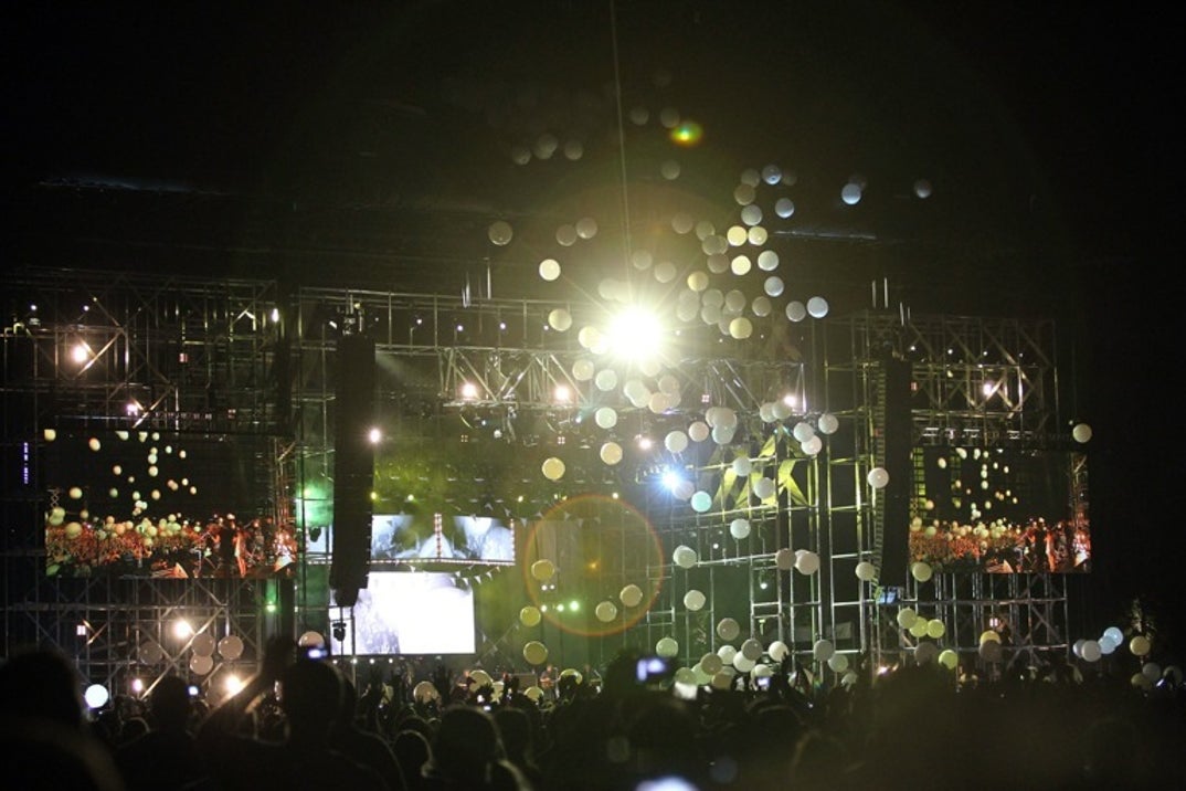 2011: Balloons fall on festival-goers as Arcade Fire performs during Day 2