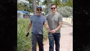 Andy Cohen and Kevin Sobieski are all smiles taking a walk during Miami getaway backgrid 1