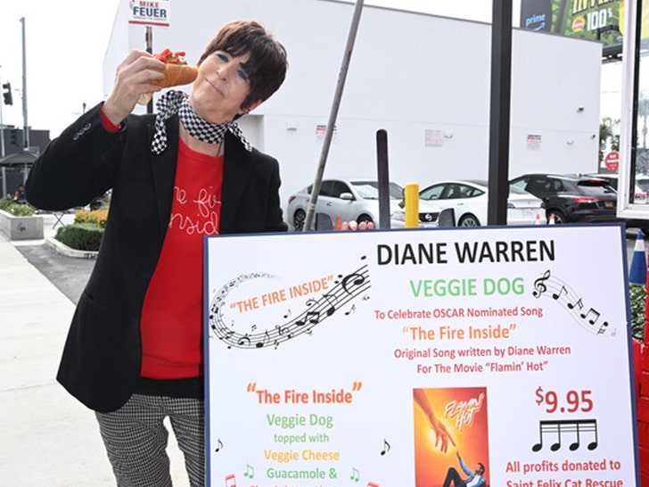 Dianne Warren appears with the vegan hot dog named after her at Pink's Hot Dogs