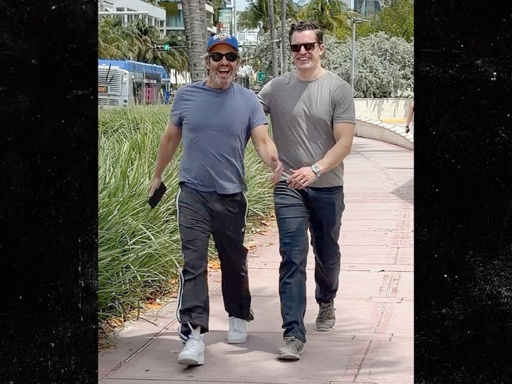 Andy Cohen and Kevin Sobieski are all smiles taking a walk during Miami getaway backgrid 1